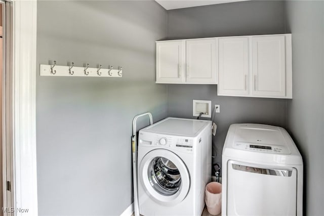 18367 Cranberry Ridge Ln, Chagrin Falls, OH 44023 - washroom with cabinet space and washing machine and dryer