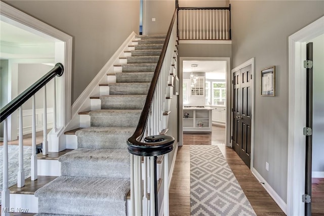 18367 Cranberry Ridge Ln, Chagrin Falls, OH 44023 - staircase with wood finished floors and a high ceiling