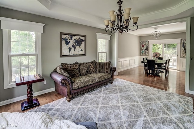 18367 Cranberry Ridge Ln, Chagrin Falls, OH 44023 - living room featuring a chandelier, wood finished floors, crown molding, and wainscoting