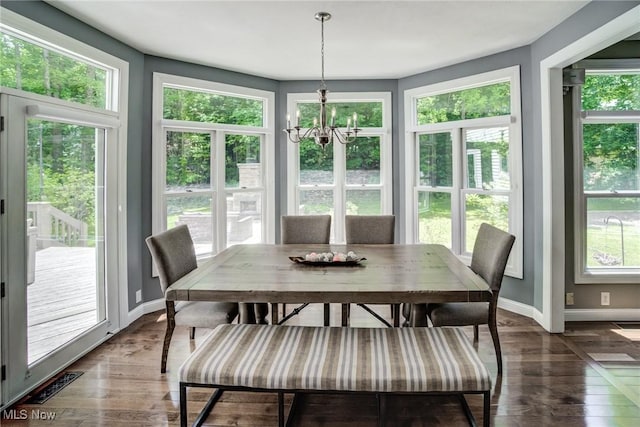 18367 Cranberry Ridge Ln, Chagrin Falls, OH 44023 - sunroom featuring healthy amount of natural light, wood finished floors, a chandelier, and a wooden deck