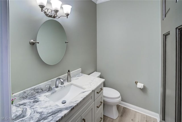18367 Cranberry Ridge Ln, Chagrin Falls, OH 44023 - bathroom with vanity, wood finished floors, a chandelier, and ornamental molding