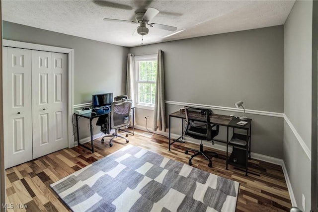 18367 Cranberry Ridge Ln, Chagrin Falls, OH 44023 - home office with a textured ceiling, wood finished floors, and ceiling fan