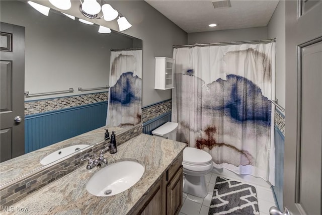 18367 Cranberry Ridge Ln, Chagrin Falls, OH 44023 - bathroom featuring vanity, a wainscoted wall, tile patterned flooring, and curtained shower