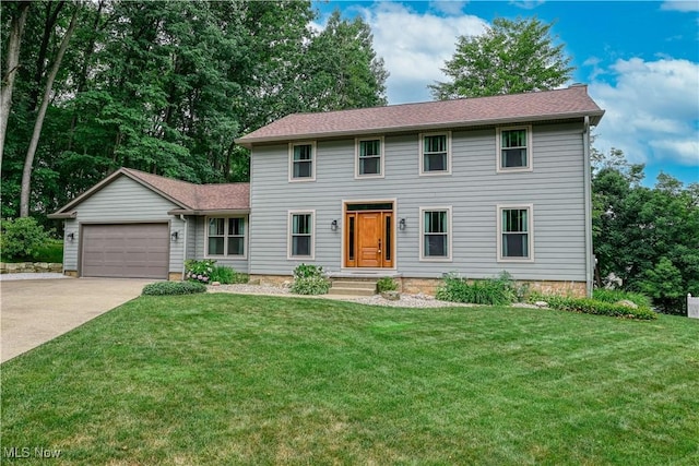 5835 Garth Cir NW, Canton, OH 44718 - colonial house with driveway, a garage, and a front lawn