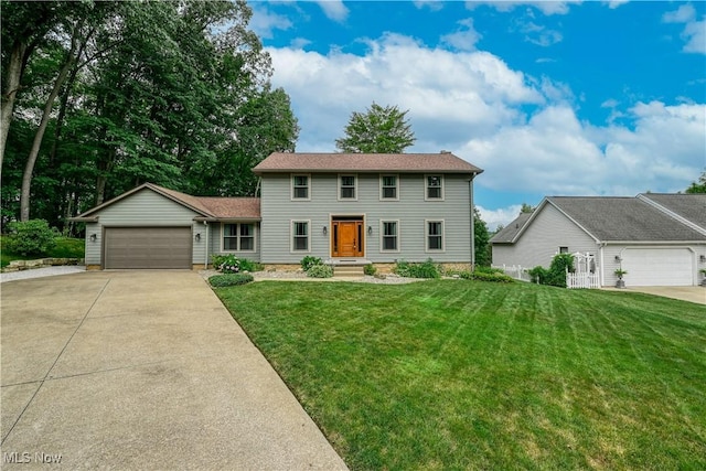 5835 Garth Cir NW, Canton, OH 44718 - colonial home featuring driveway, a garage, and a front lawn