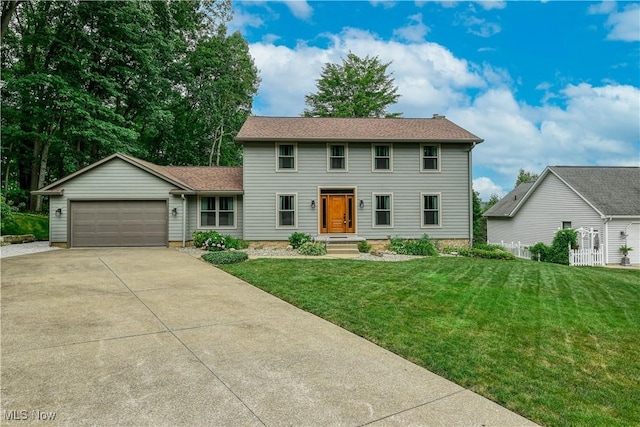 5835 Garth Cir NW, Canton, OH 44718 - colonial inspired home featuring driveway, an attached garage, and a front yard