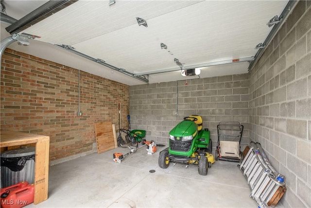 5835 Garth Cir NW, Canton, OH 44718 - garage featuring a garage door opener and concrete block wall