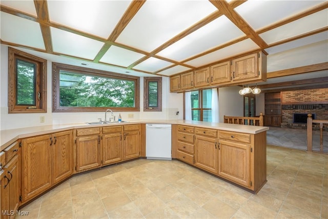 5835 Garth Cir NW, Canton, OH 44718 - kitchen featuring white dishwasher, a peninsula, plenty of natural light, and a brick fireplace
