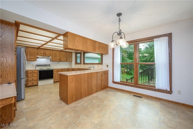 5835 Garth Cir NW, Canton, OH 44718 - kitchen featuring electric stove, freestanding refrigerator, under cabinet range hood, a peninsula, and light countertops