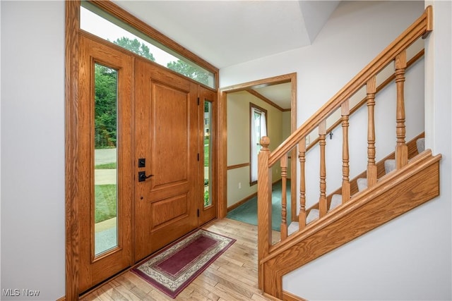 5835 Garth Cir NW, Canton, OH 44718 - foyer entrance featuring light wood-type flooring and stairway