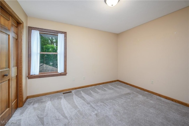 5835 Garth Cir NW, Canton, OH 44718 - spare room with light carpet and baseboards