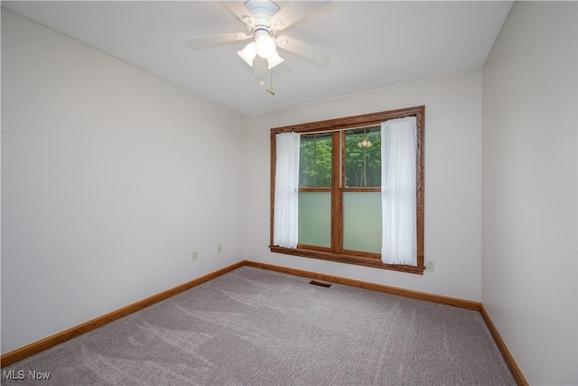 5835 Garth Cir NW, Canton, OH 44718 - carpeted empty room with baseboards and ceiling fan