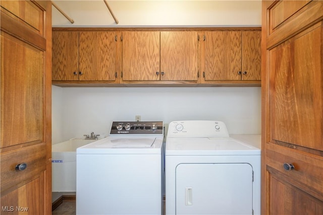 5835 Garth Cir NW, Canton, OH 44718 - laundry room featuring separate washer and dryer and cabinet space