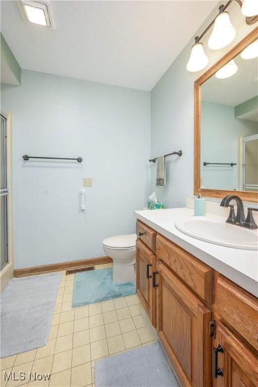 5835 Garth Cir NW, Canton, OH 44718 - bathroom featuring a shower with shower door, vanity, and tile patterned floors