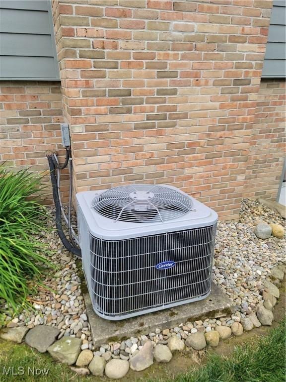 5835 Garth Cir NW, Canton, OH 44718 - exterior view of a central AC unit and brick siding