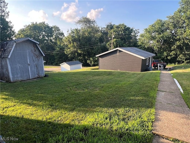 423 W Main St, Barnesville, OH 43713 - view of green lawn with a storage shed