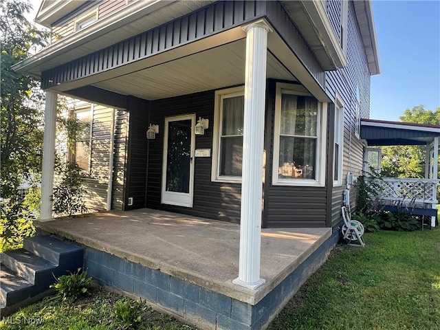 423 W Main St, Barnesville, OH 43713 - doorway to property featuring a porch