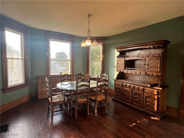 423 W Main St, Barnesville, OH 43713 - dining room featuring dark wood finished floors and a chandelier