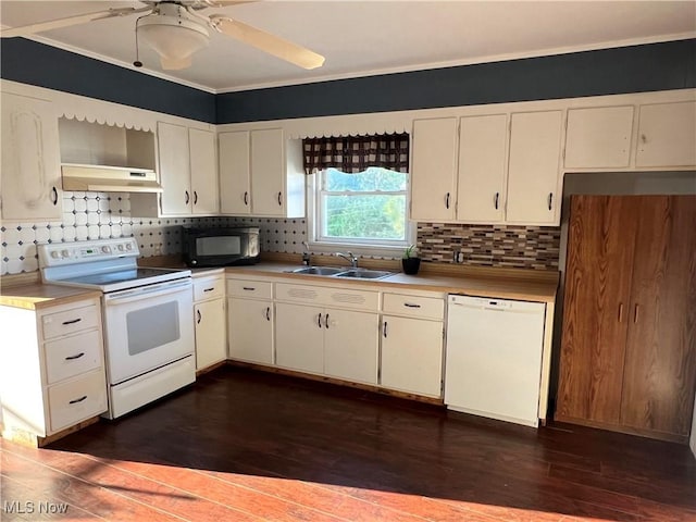 423 W Main St, Barnesville, OH 43713 - kitchen with white appliances, tasteful backsplash, dark wood-style flooring, under cabinet range hood, and ornamental molding