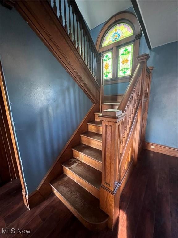 423 W Main St, Barnesville, OH 43713 - staircase featuring hardwood / wood-style flooring and a towering ceiling
