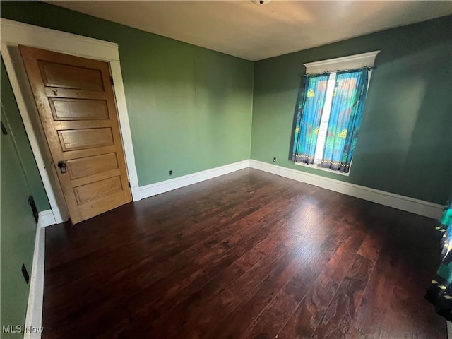 423 W Main St, Barnesville, OH 43713 - spare room with dark wood-type flooring and baseboards