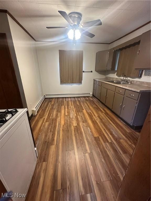 600 Jeanette Ave, Martins Ferry, OH 43935 - kitchen featuring gray cabinets, range, a ceiling fan, a baseboard heating unit, and dark wood finished floors