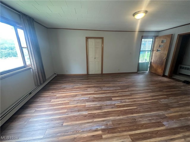 600 Jeanette Ave, Martins Ferry, OH 43935 - unfurnished room featuring a baseboard radiator, wood finished floors, and ornamental molding