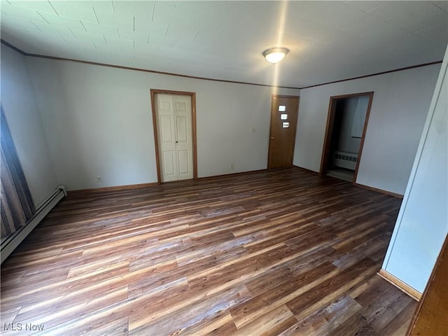 600 Jeanette Ave, Martins Ferry, OH 43935 - spare room with wood finished floors, radiator, crown molding, and a baseboard heating unit