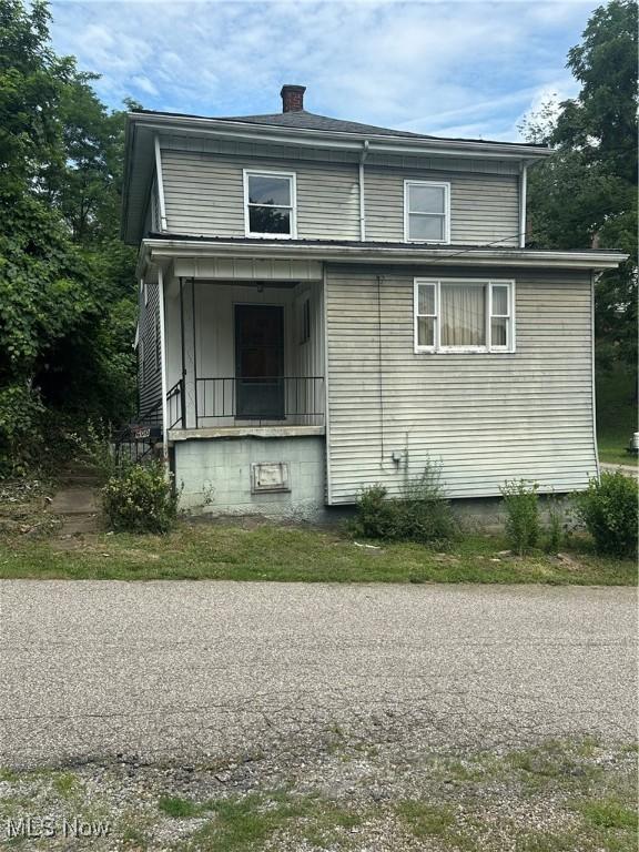 600 Jeanette Ave, Martins Ferry, OH 43935 - view of property exterior featuring a chimney and a porch
