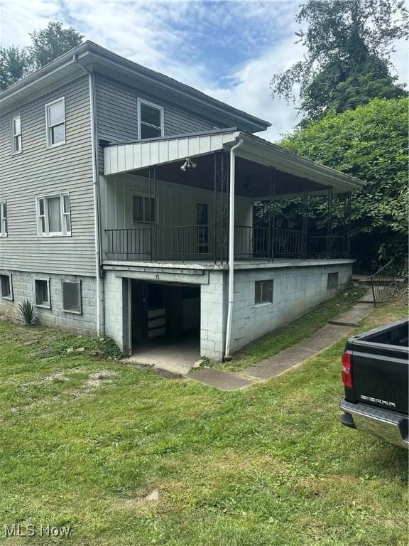 600 Jeanette Ave, Martins Ferry, OH 43935 - view of property exterior with a yard and an attached garage