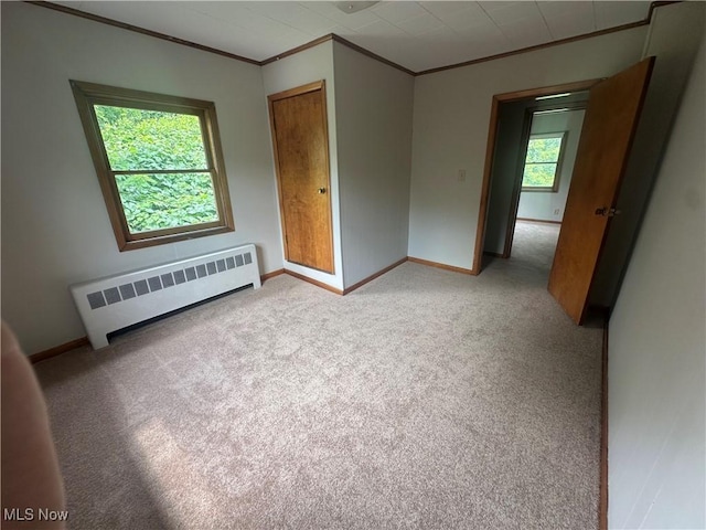 600 Jeanette Ave, Martins Ferry, OH 43935 - empty room featuring radiator, crown molding, and light carpet