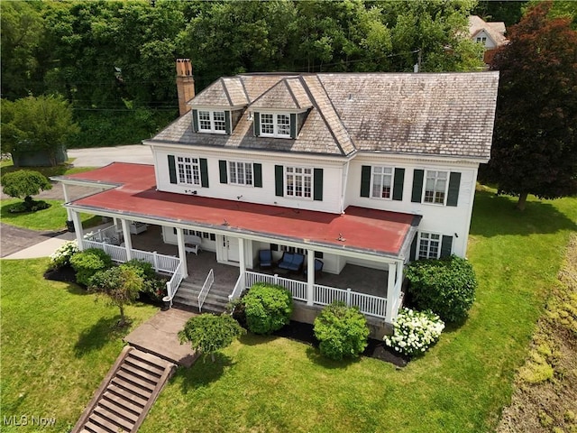 12 Lotus Ave, Chester, WV 26034 - view of front facade with a porch, a chimney, and a front yard