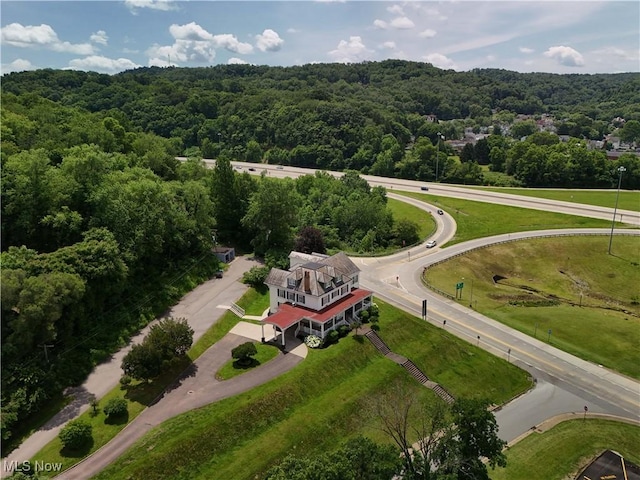12 Lotus Ave, Chester, WV 26034 - aerial view of property and surrounding area with a heavily wooded area