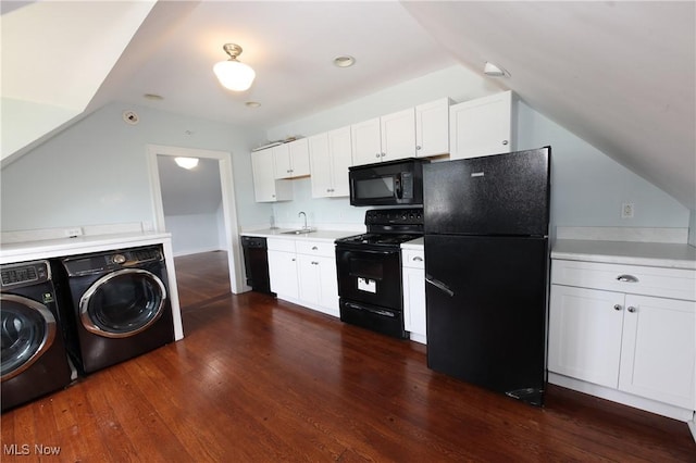 12 Lotus Ave, Chester, WV 26034 - kitchen with black appliances, independent washer and dryer, lofted ceiling, light countertops, and white cabinetry