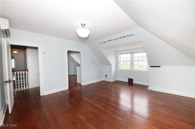 12 Lotus Ave, Chester, WV 26034 - additional living space with wood-type flooring, a wall mounted AC, and vaulted ceiling