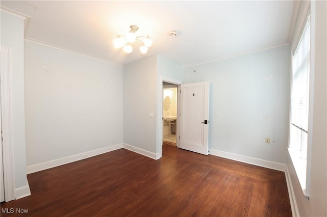 12 Lotus Ave, Chester, WV 26034 - empty room with wood finished floors, a chandelier, healthy amount of natural light, and ornamental molding