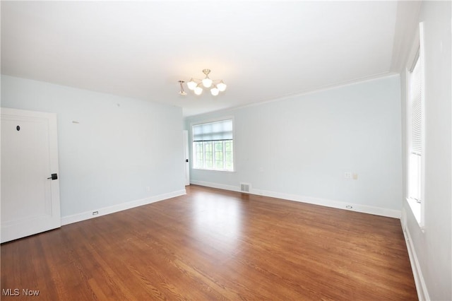 12 Lotus Ave, Chester, WV 26034 - spare room featuring wood finished floors and a chandelier