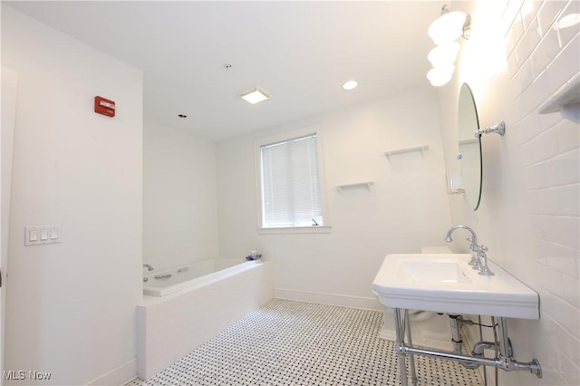 12 Lotus Ave, Chester, WV 26034 - bathroom with a bath and recessed lighting