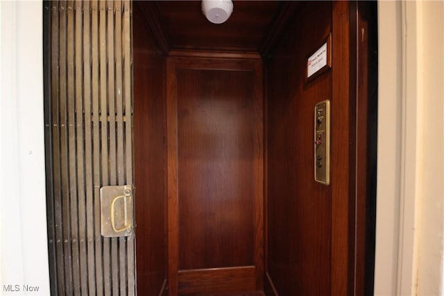 12 Lotus Ave, Chester, WV 26034 - elevator featuring ornamental molding and wood walls