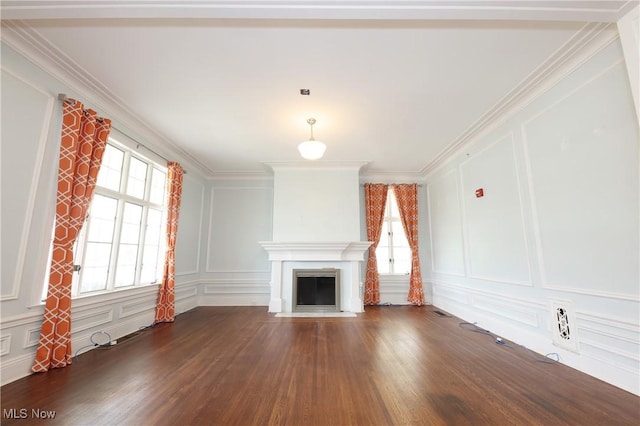 12 Lotus Ave, Chester, WV 26034 - unfurnished living room featuring a decorative wall, dark wood-type flooring, crown molding, and a fireplace with flush hearth