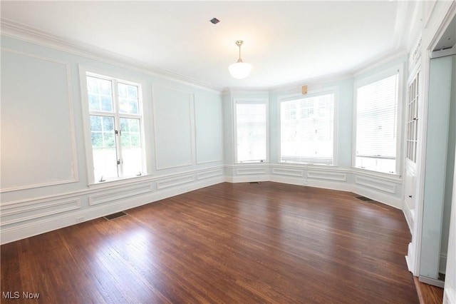 12 Lotus Ave, Chester, WV 26034 - spare room featuring a decorative wall, ornamental molding, and dark wood-style flooring