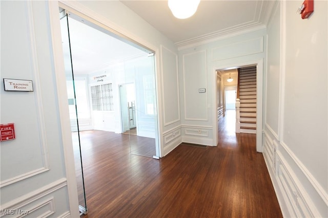 12 Lotus Ave, Chester, WV 26034 - corridor with a decorative wall, dark wood finished floors, healthy amount of natural light, and crown molding