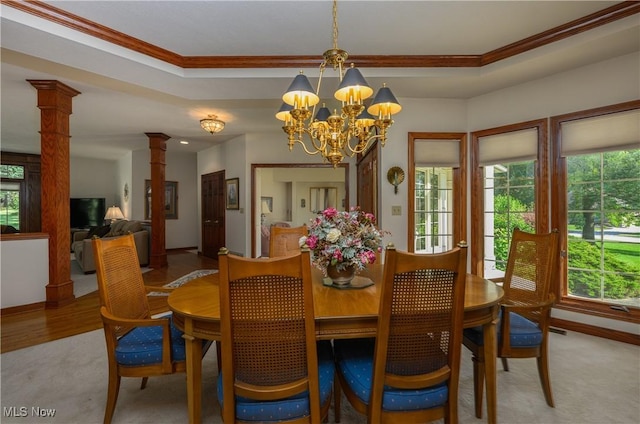 1110 Mansion Dr, Barberton, OH 44203 - dining room featuring ornate columns, crown molding, a chandelier, and carpet floors
