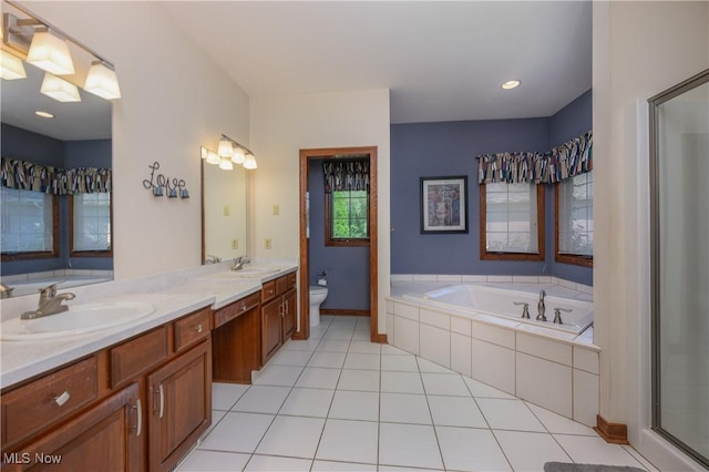 1110 Mansion Dr, Barberton, OH 44203 - bathroom featuring double vanity, a bath, a shower stall, and tile patterned floors