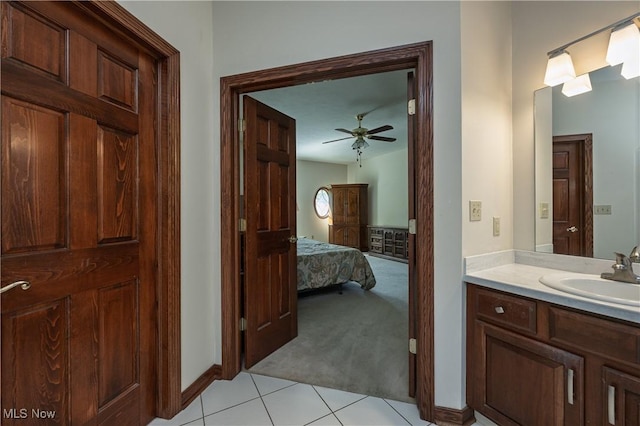 1110 Mansion Dr, Barberton, OH 44203 - ensuite bathroom featuring vanity, tile patterned floors, and a ceiling fan