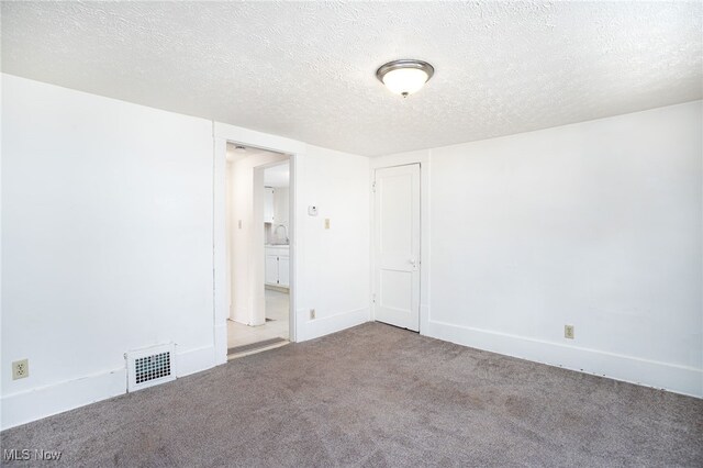 1333 Meriline St, Cuyahoga Falls, OH 44221 - spare room with carpet flooring and a textured ceiling