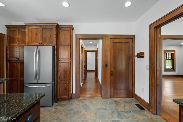 159 Edgerton Rd, Akron, OH 44303 - kitchen featuring freestanding refrigerator, dark stone countertops, recessed lighting, and stone finish flooring