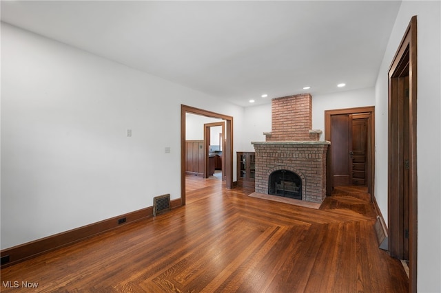 159 Edgerton Rd, Akron, OH 44303 - unfurnished living room featuring a brick fireplace and recessed lighting