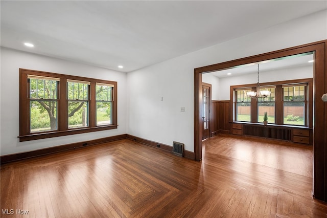 159 Edgerton Rd, Akron, OH 44303 - unfurnished room featuring radiator heating unit, a chandelier, healthy amount of natural light, and recessed lighting