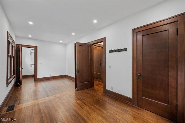159 Edgerton Rd, Akron, OH 44303 - unfurnished bedroom featuring dark wood-style floors and recessed lighting